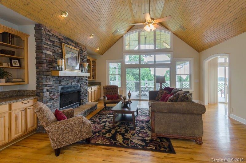 105 Spring Path, Unit 77 Hendersonville, NC 28739 - Photo 5 of 21 a living room with furniture fireplace and a large window