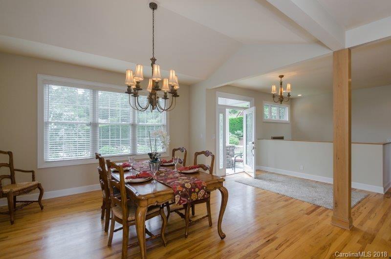 105 Spring Path, Unit 77 Hendersonville, NC 28739 - Photo 7 of 21 a view of a dining room with furniture and window