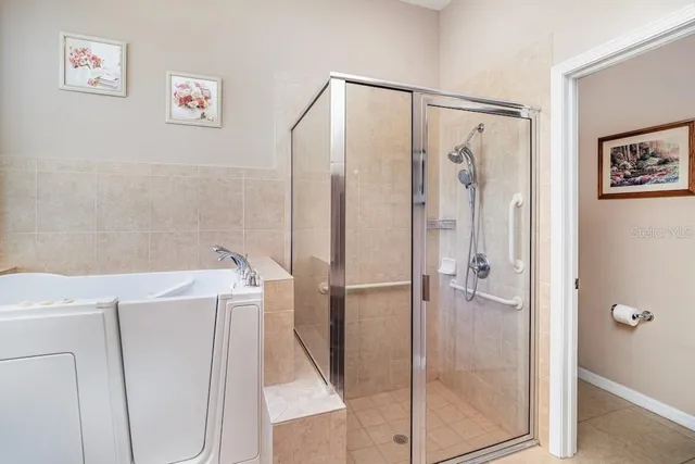 a bathroom with a shower and a sink