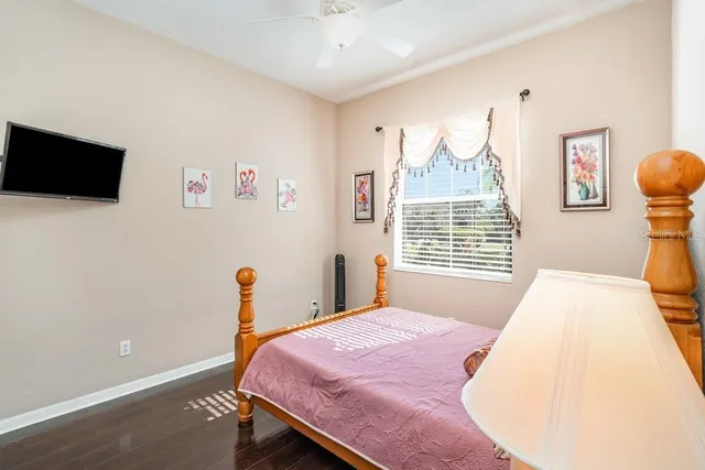 a bedroom with a bed and a chair