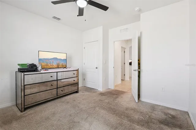 a view of room with window and cabinet