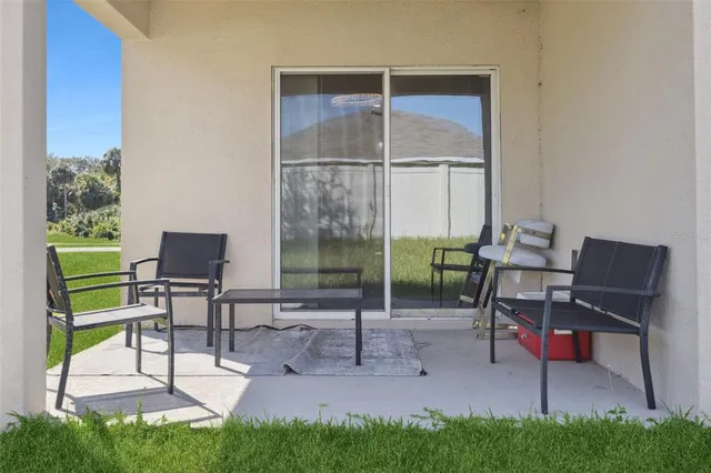 a view of a two chairs in the garden