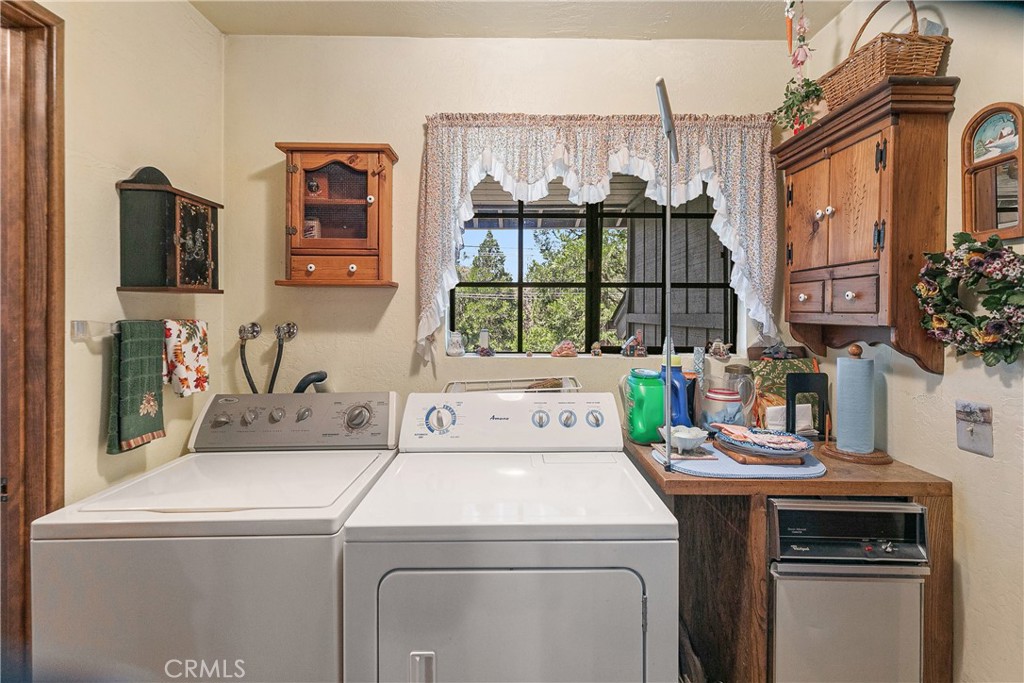 329 Grass Valley Road Lake Arrowhead, CA 92352 - Photo 22 of 31 a utility room with dryer and washer