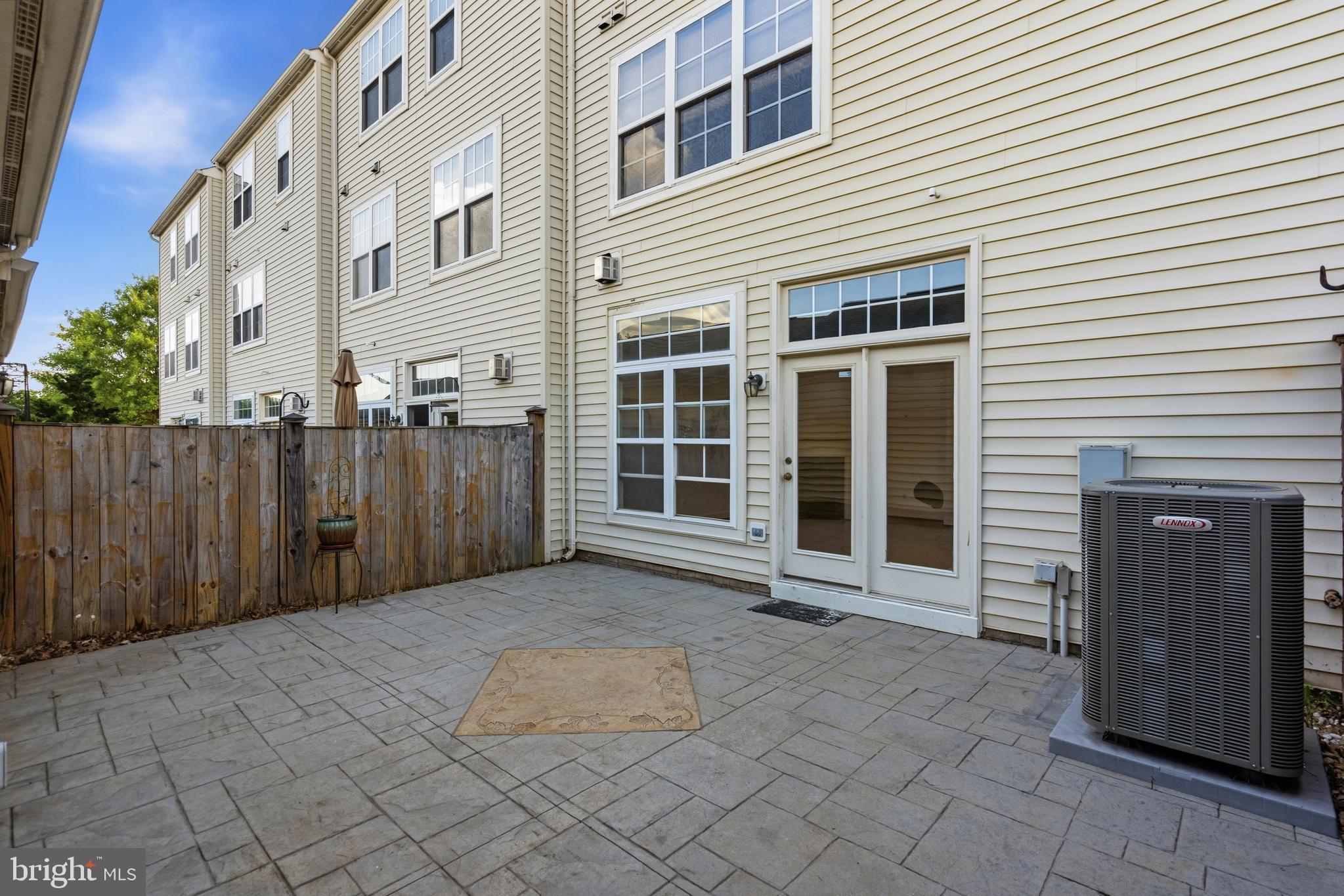 9227 Ribbon Falls Loop Bristow, VA 20136 - Photo 29 of 53 a view of a house with backyard and wooden fence