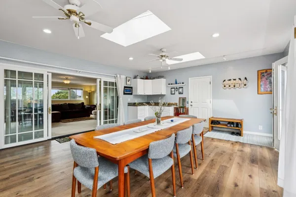 a view of a dining room with furniture window and wooden floor