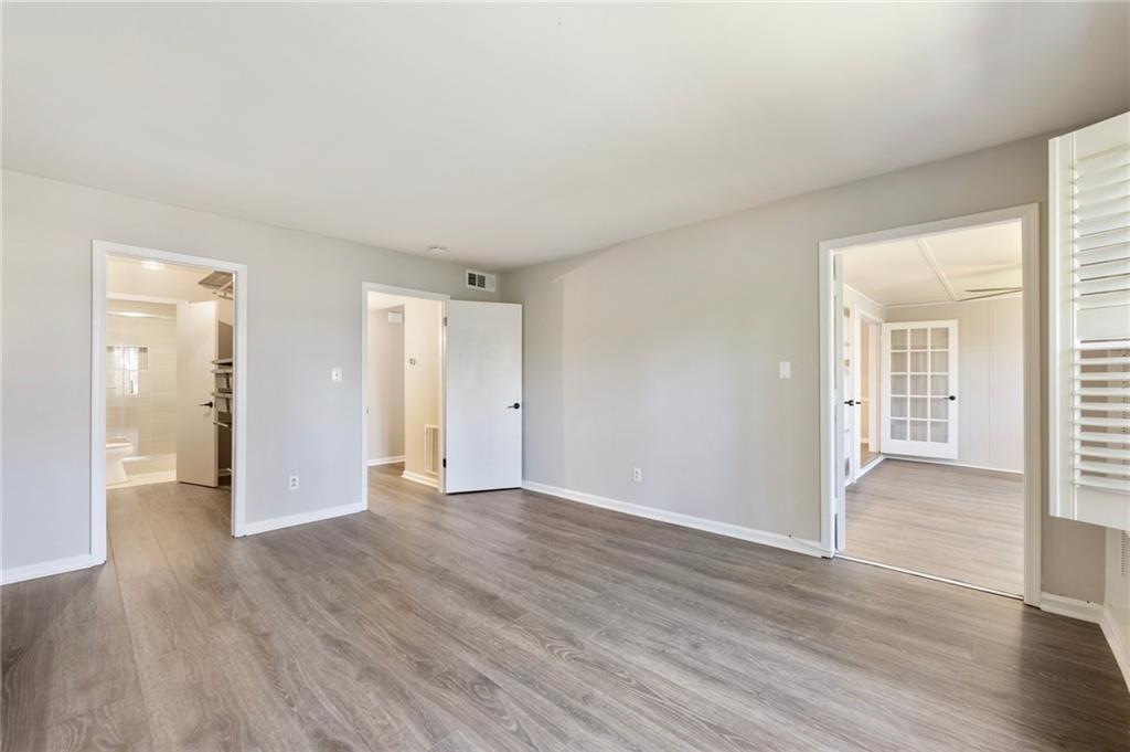 162 Amherst Place Northwest Atlanta, GA 30327 - Photo 14 of 24 a view of an empty room with wooden floor