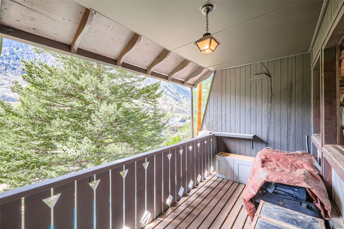819 Valley View Drive Georgetown, CO 80444 - Photo 23 of 29 a balcony with wooden floor and outdoor space