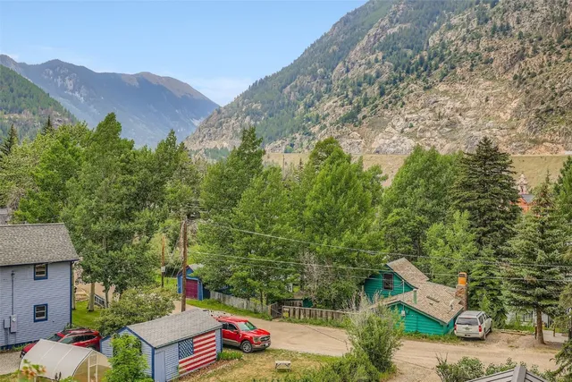 an aerial view of a house with mountain view