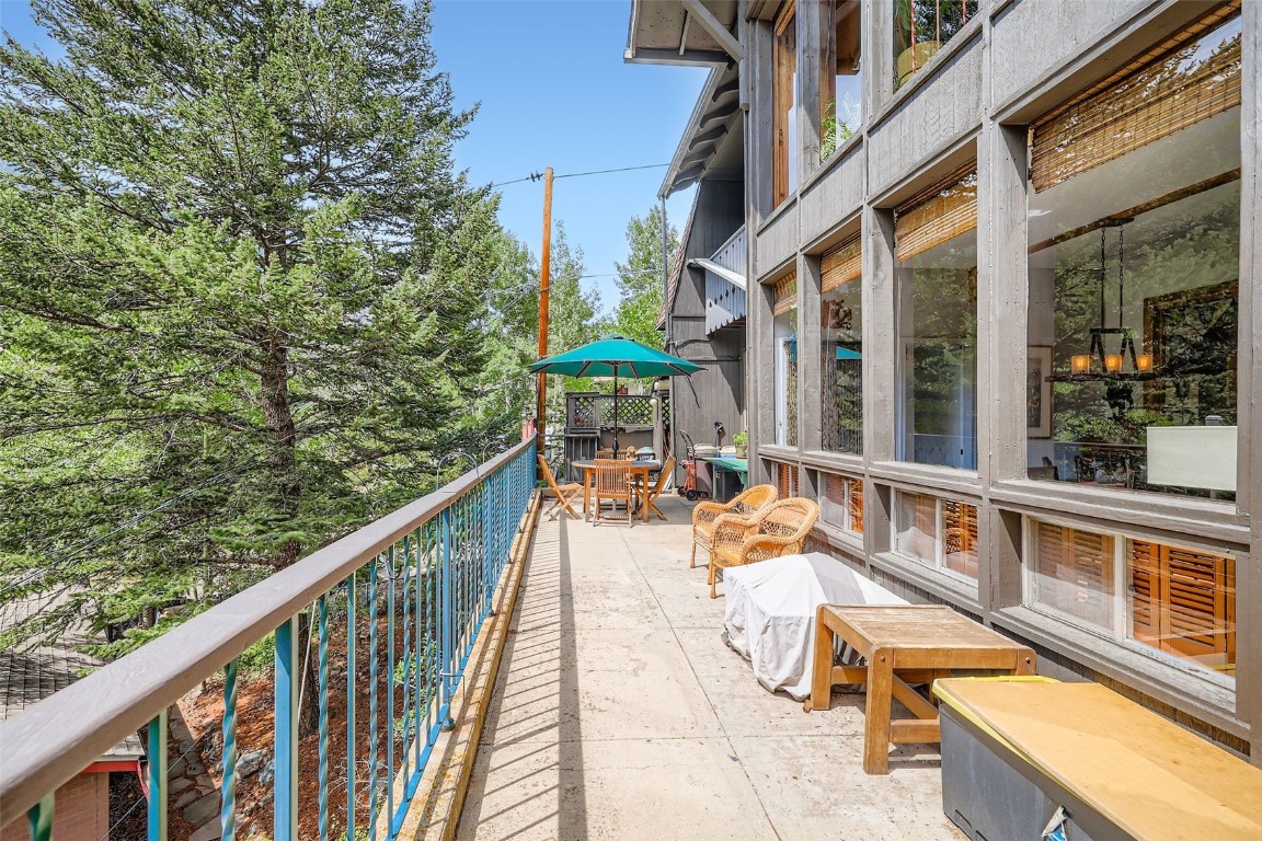 819 Valley View Drive Georgetown, CO 80444 - Photo 10 of 29 a view of a balcony with chairs and iron fence
