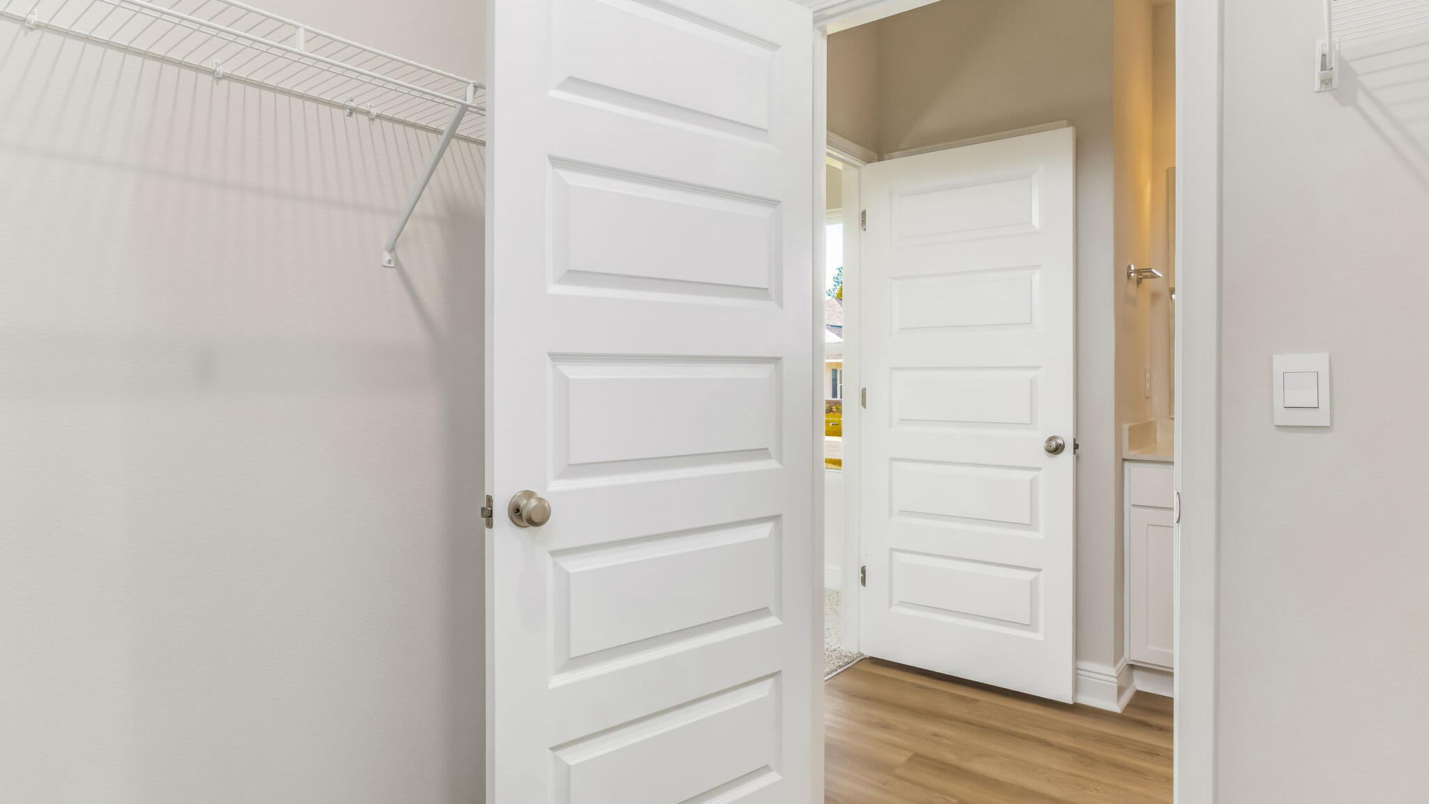 5619 Thatcher Road Crestview, FL 32539 - Photo 20 of 32 a view of walk in closet with empty racks