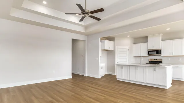 a view of kitchen with wooden floor and window