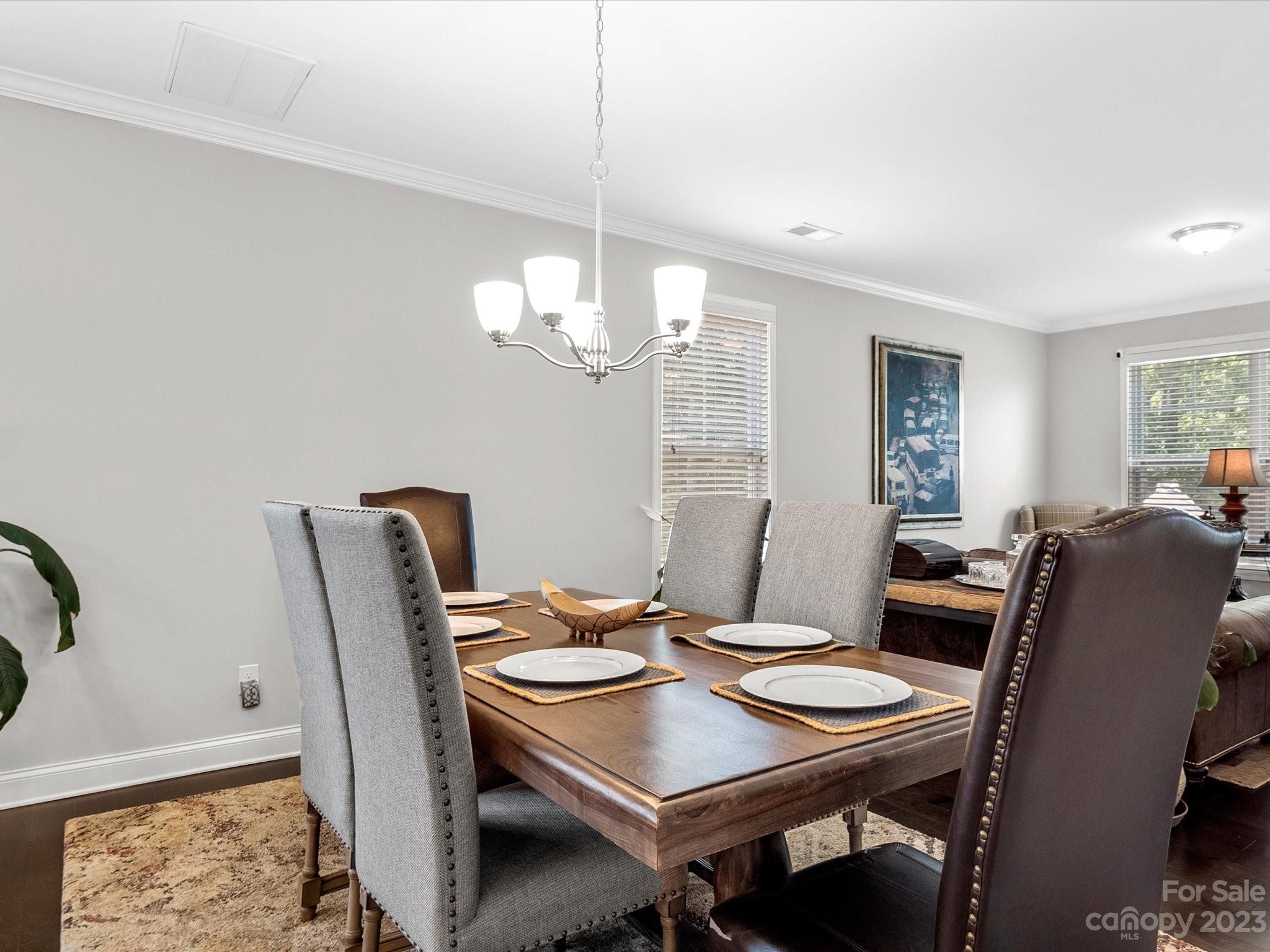 6020 Gribble Lane Lancaster, SC 29720 - Photo 14 of 32 a view of a dining room with furniture window and wooden floor