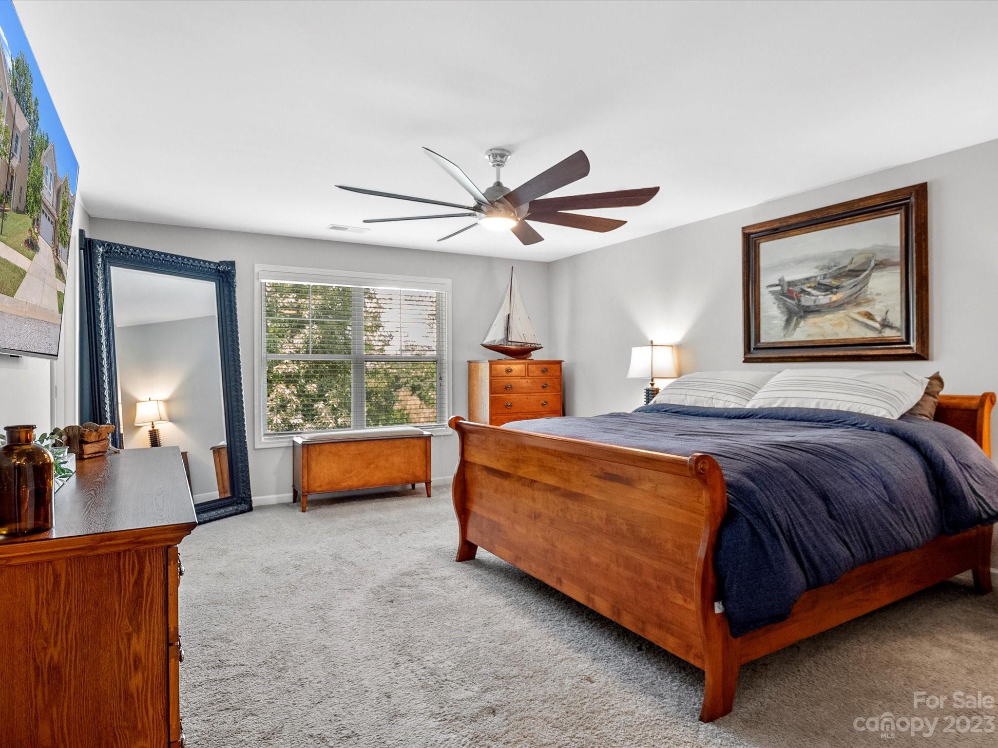 6020 Gribble Lane Lancaster, SC 29720 - Photo 20 of 32 a bedroom with a bed and large windows