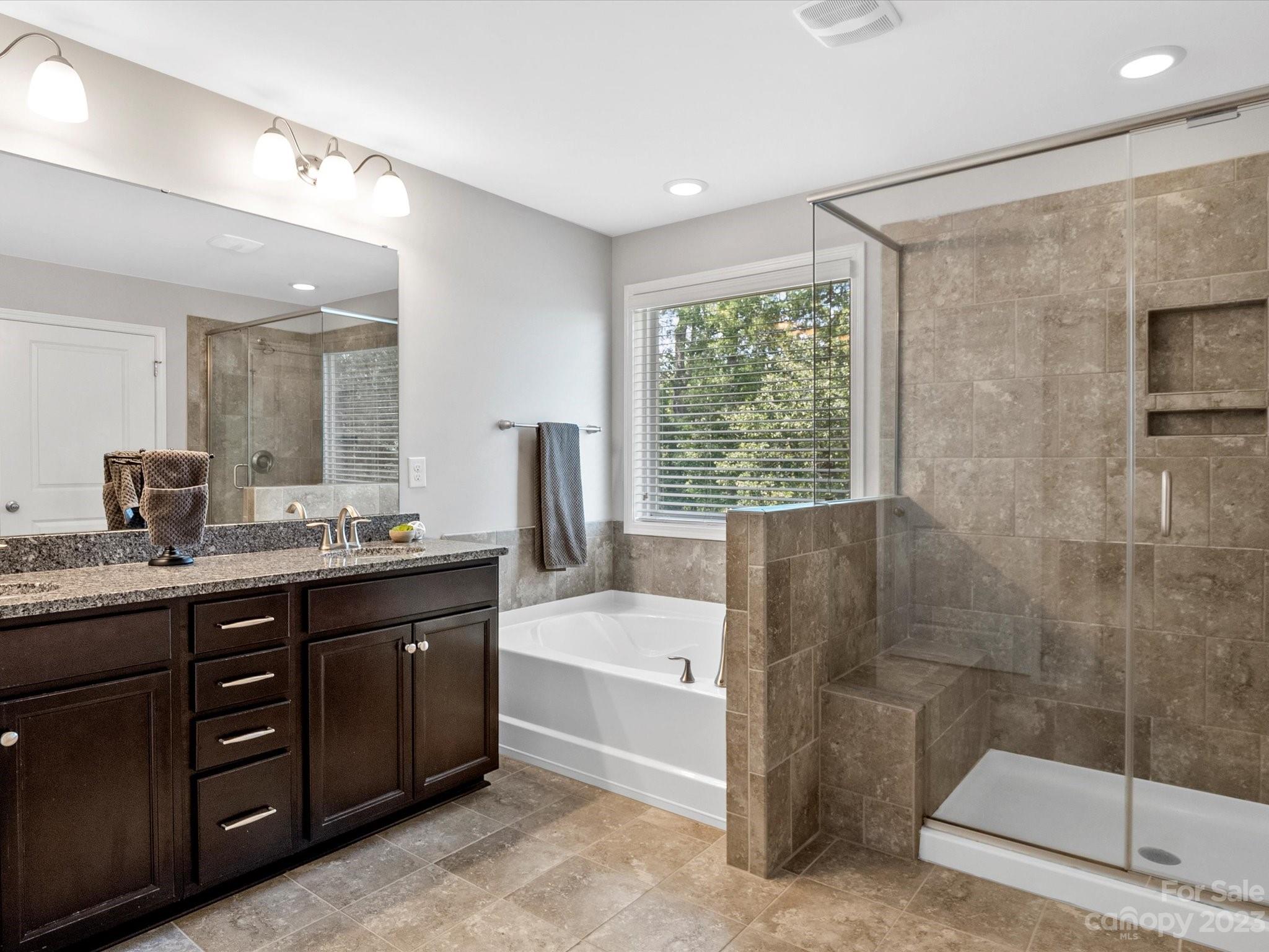 6020 Gribble Lane Lancaster, SC 29720 - Photo 23 of 32 a bathroom with a tub sink and mirror