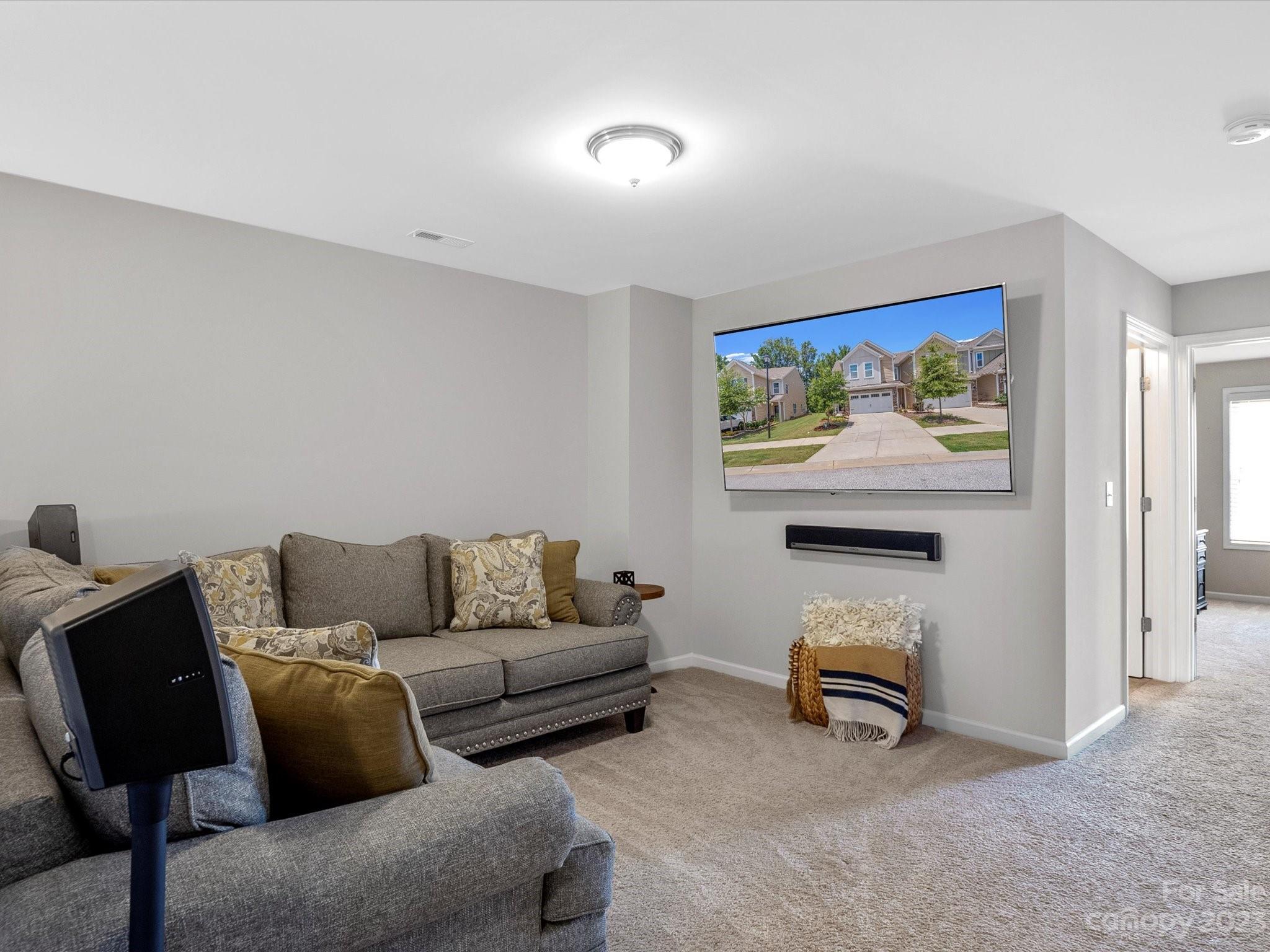 6020 Gribble Lane Lancaster, SC 29720 - Photo 25 of 32 a living room with furniture and a flat screen tv