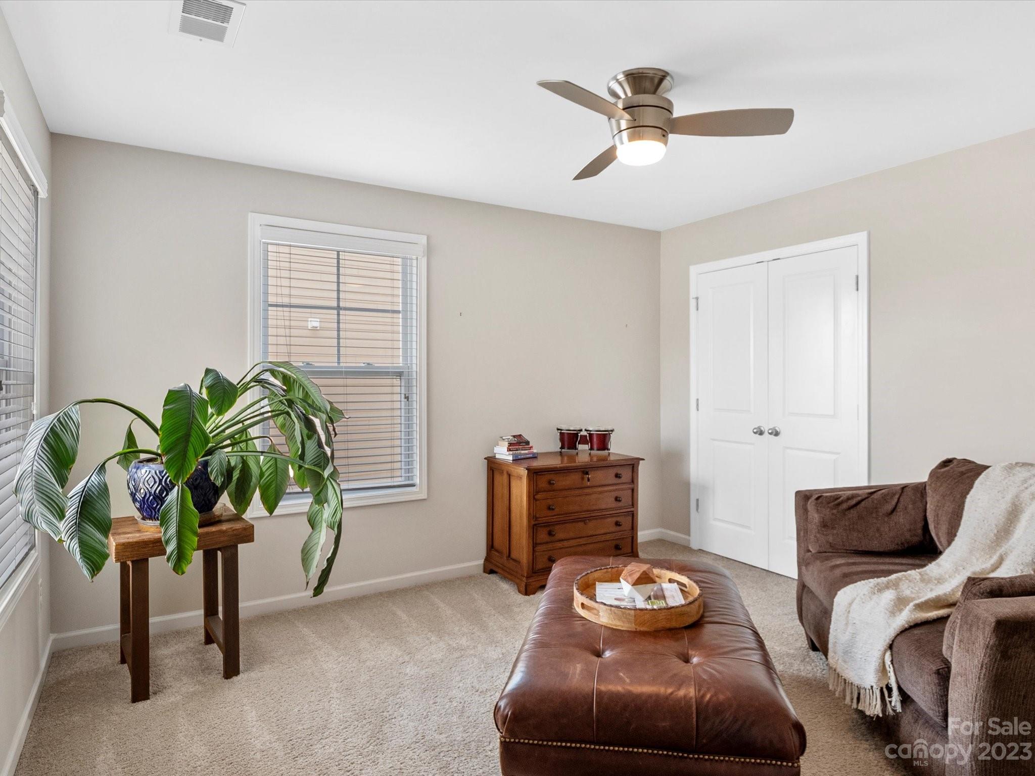 6020 Gribble Lane Lancaster, SC 29720 - Photo 26 of 32 a living room with furniture and a potted plant