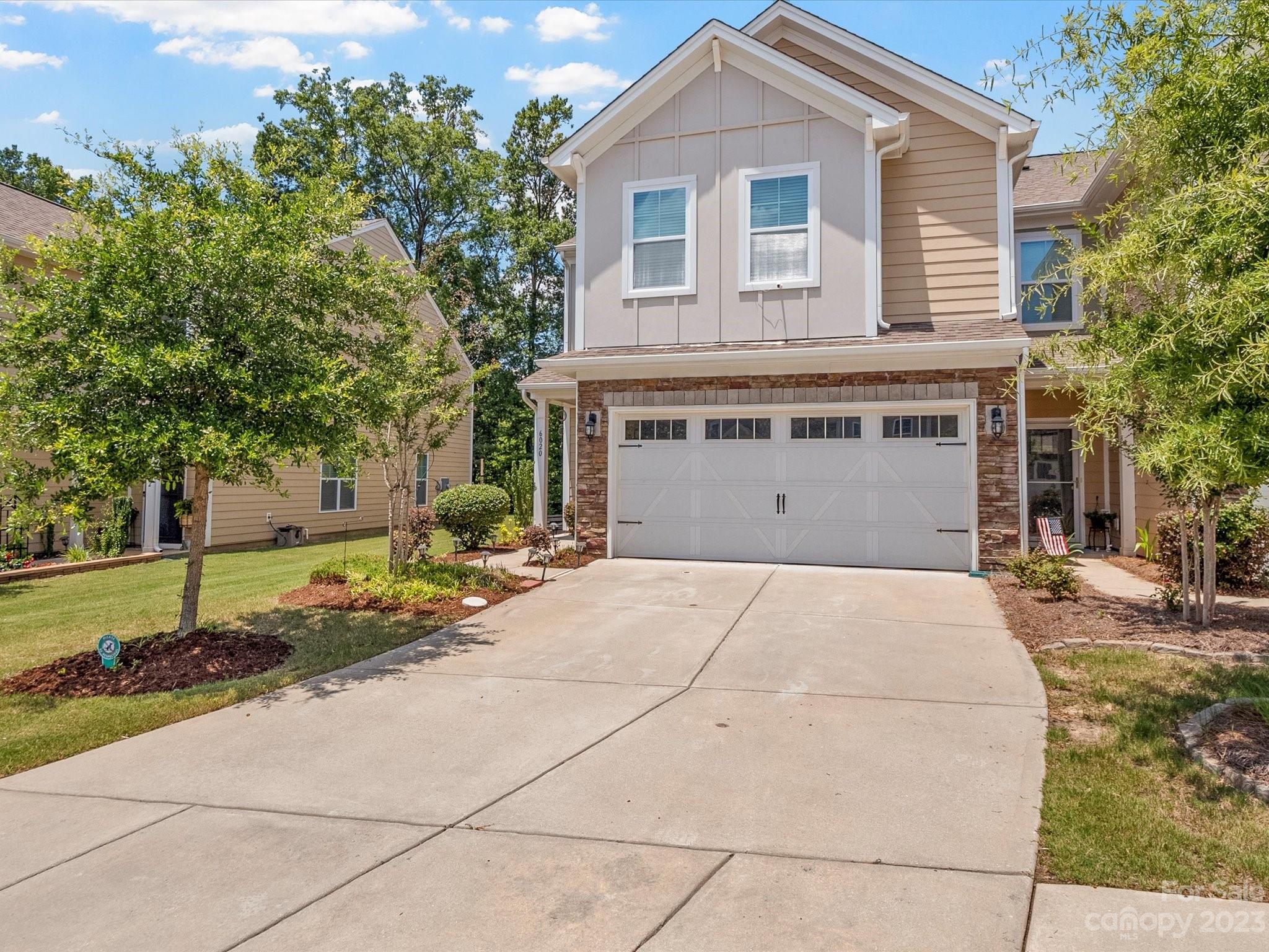 6020 Gribble Lane Lancaster, SC 29720 - Photo 3 of 32 a front view of a house with a yard and garage