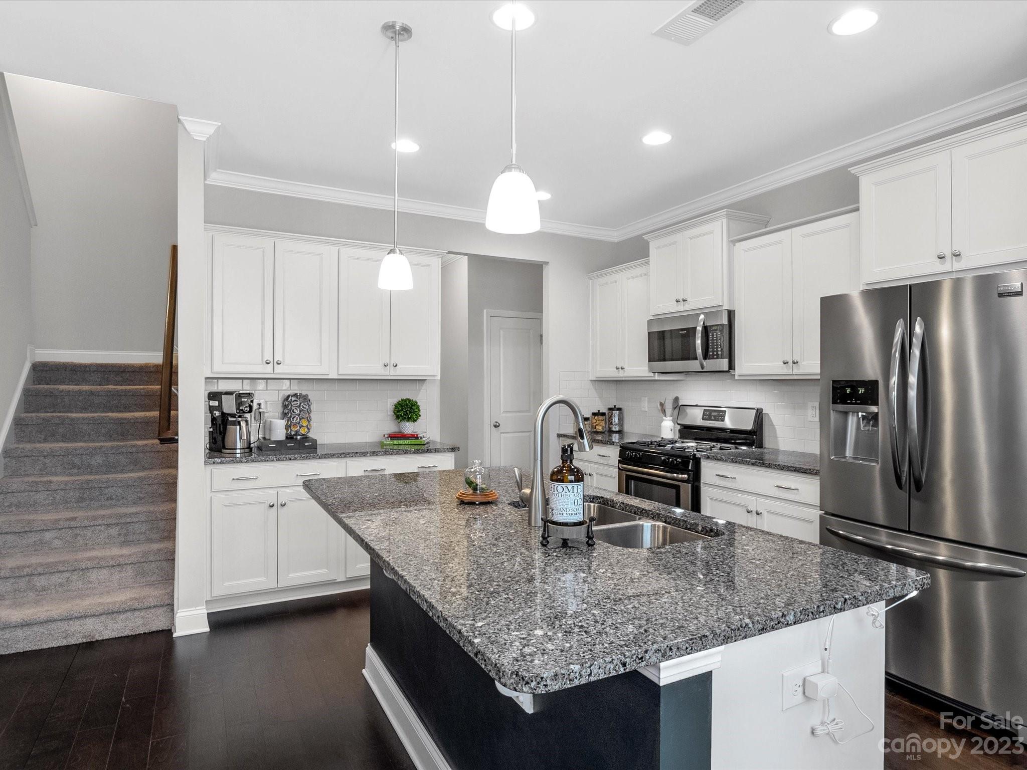 6020 Gribble Lane Lancaster, SC 29720 - Photo 7 of 32 a kitchen with appliances cabinets a sink and a counter top space