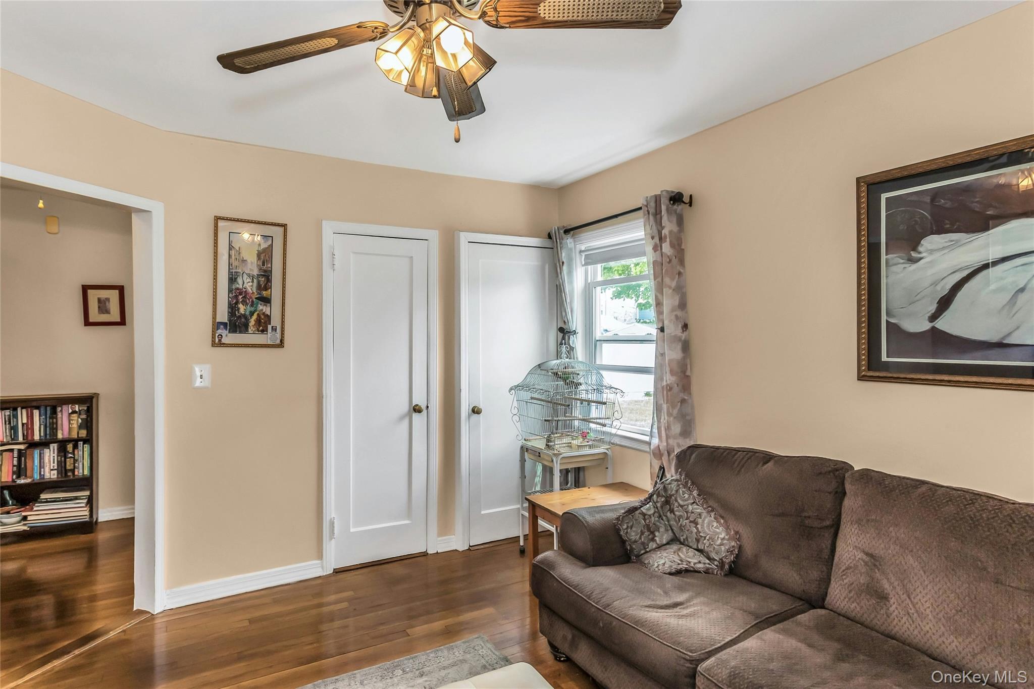 97 Horton Road Valley Stream, NY 11581 - Photo 11 of 21 a living room with furniture and a window