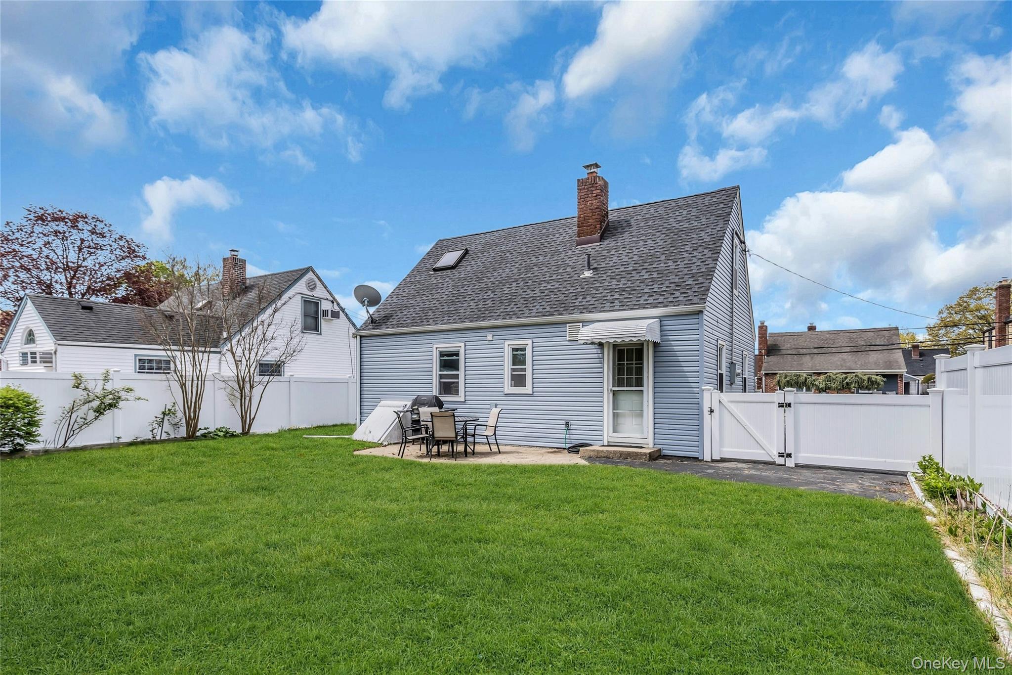 97 Horton Road Valley Stream, NY 11581 - Photo 20 of 21 a front view of a house with garden