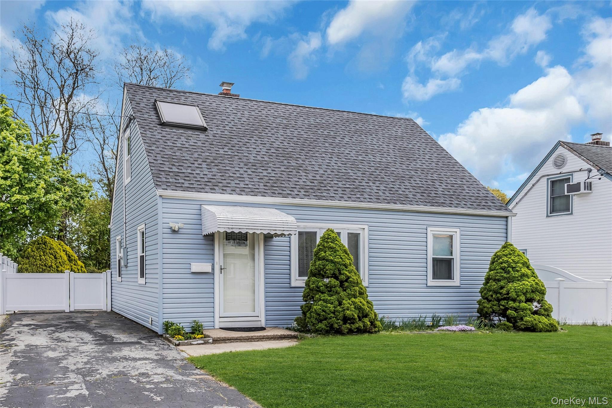 97 Horton Road Valley Stream, NY 11581 - Photo 3 of 21 a front view of a house with a garden
