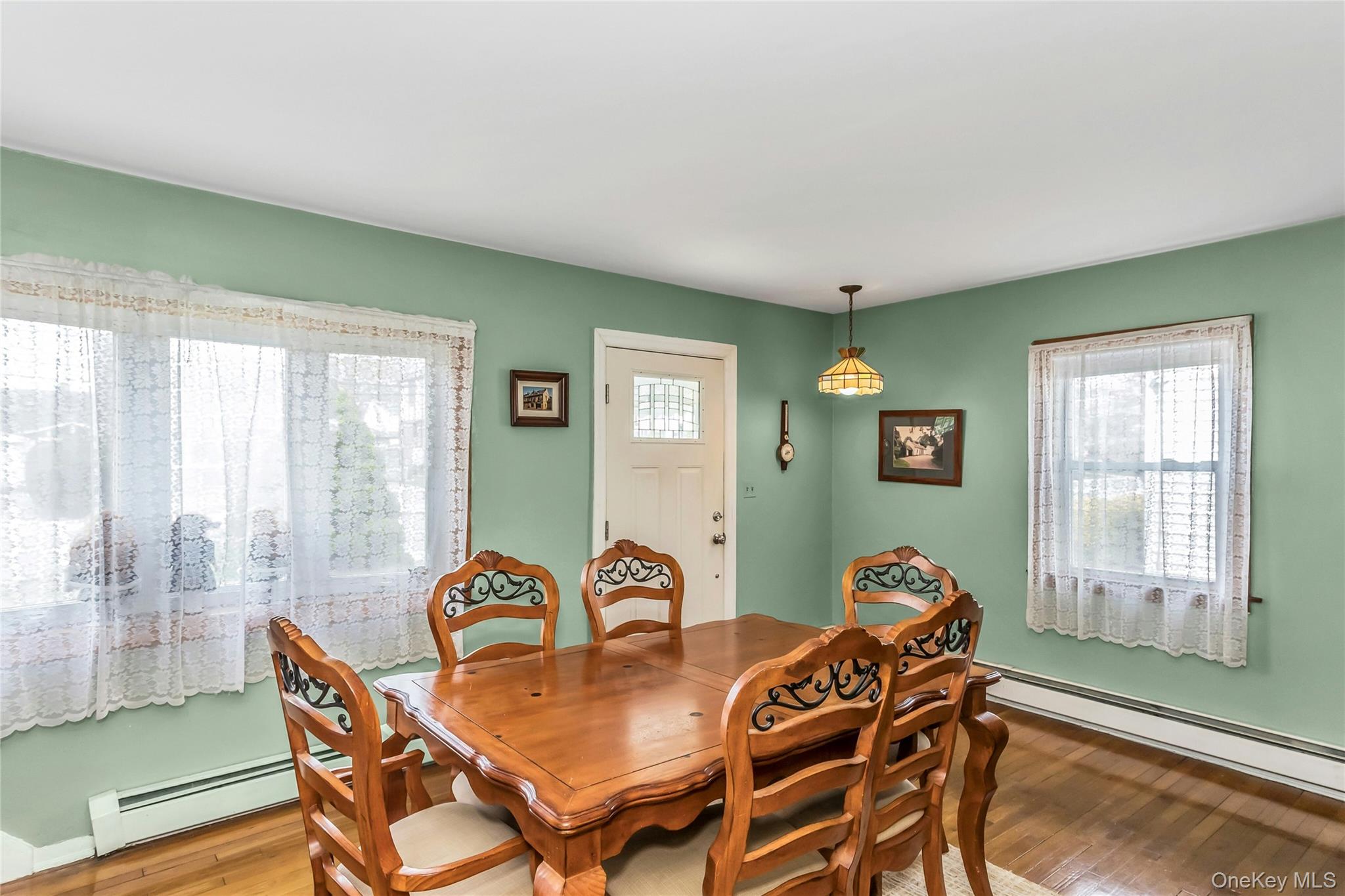 97 Horton Road Valley Stream, NY 11581 - Photo 9 of 21 a dining room with furniture and window