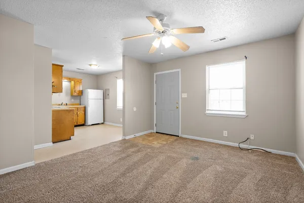 a view of a kitchen with a sink and a window