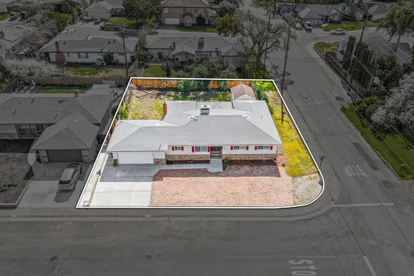 an aerial view of house with pool