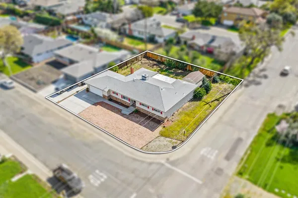 an aerial view of a house with a swimming pool