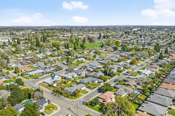 an aerial view of residential houses with outdoor space