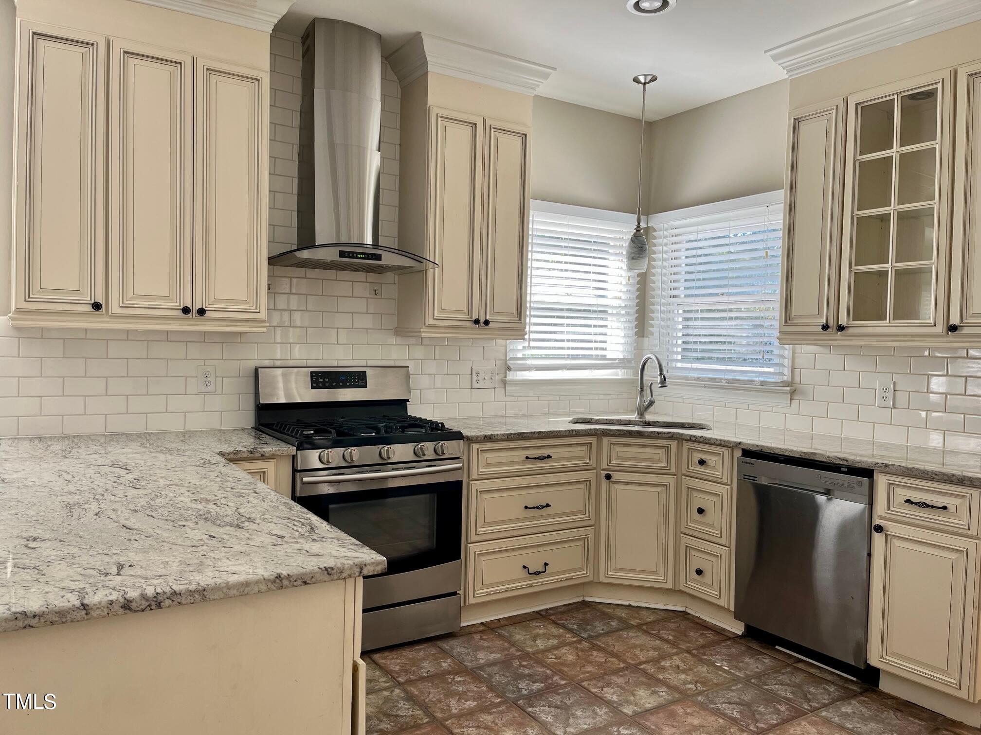 5205 Bakers Mill Road Durham, NC 27707 - Photo 8 of 21 Stainless appliances and granite countertops feature in the kitchen