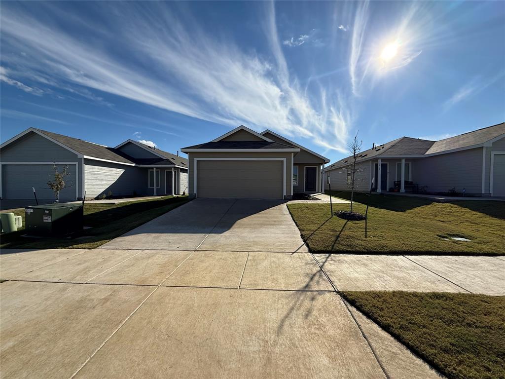 a view of a house with a wooden fence