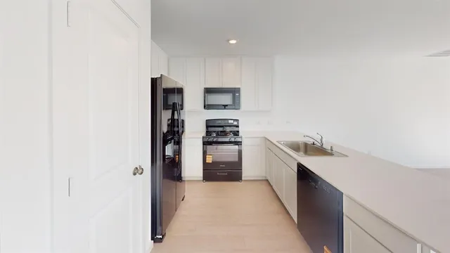 a kitchen with a sink and cabinets