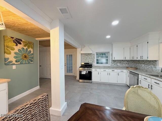 4710 Massey Road Macon, GA 31206 - Photo 8 of 27 a kitchen with stainless steel appliances granite countertop a stove a sink and a refrigerator