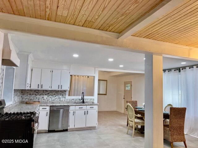 4710 Massey Road Macon, GA 31206 - Photo 9 of 27 a kitchen with granite countertop a stove chairs sink and cabinets