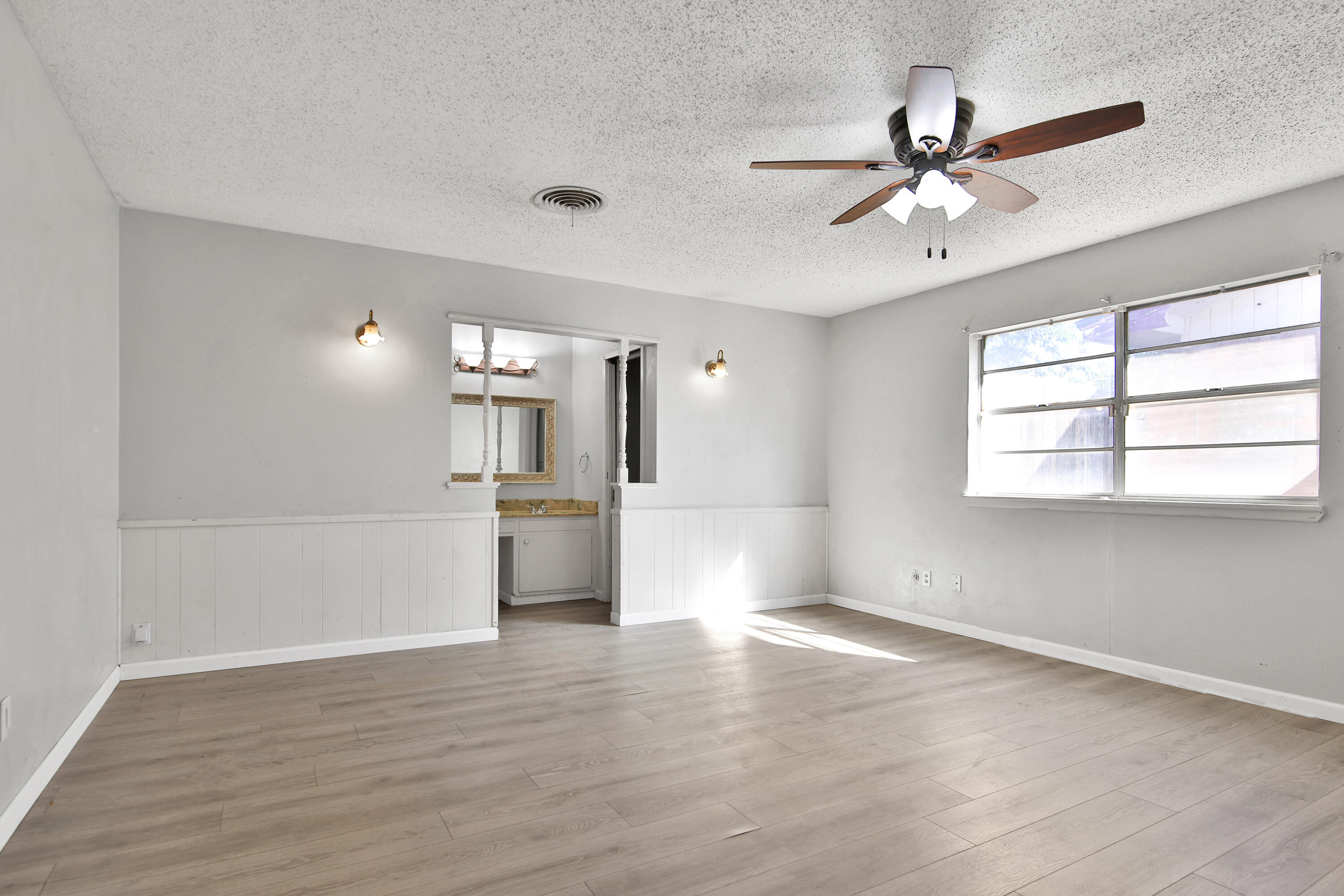 6607 Avenue U Lubbock, TX 79412 - Photo 11 of 25 a view of a livingroom with a ceiling fan and window