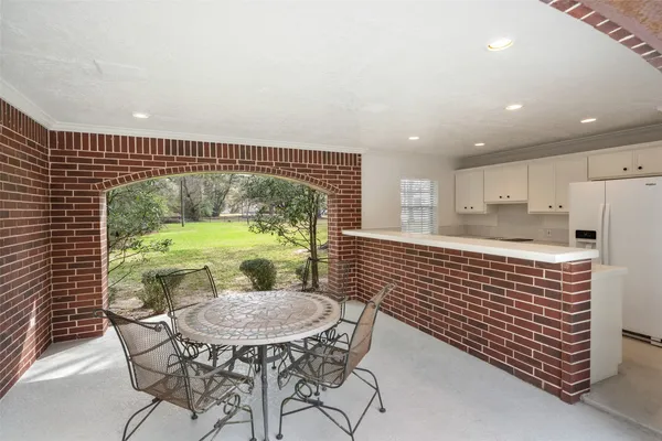 a view of green field with trees
