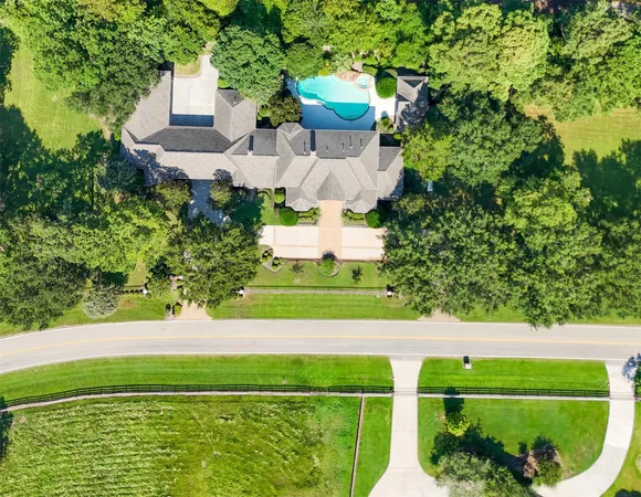 a kitchen with granite countertop a stove sink and cabinets