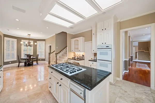 a bathroom with a toilet a sink and a mirror