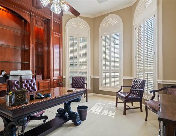 a living room with furniture a table and chairs