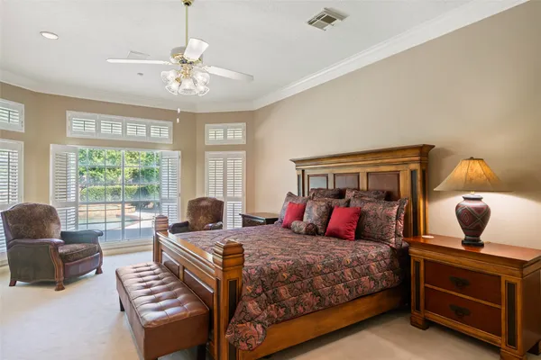 a large white kitchen with a stove and cabinets