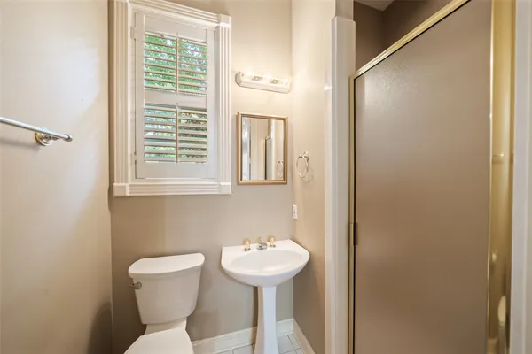 a living room with furniture a rug and a window