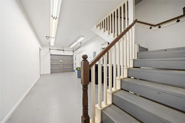 a view of an empty room with stairs