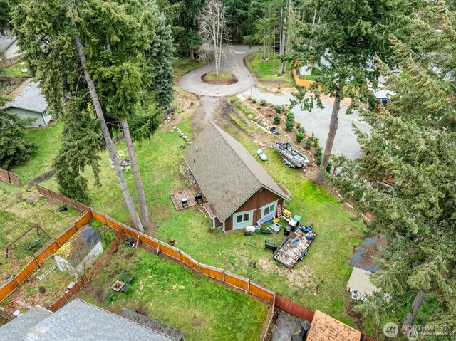 an aerial view of house with yard