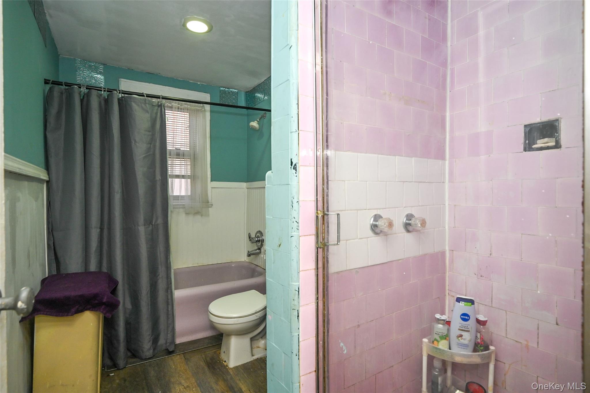 134-21 229th Street Queens, NY 11413 - Photo 12 of 25 a bathroom with a shower toilet and sink