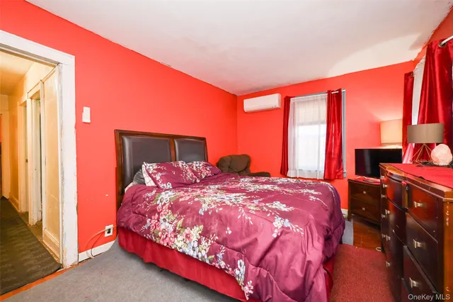 a bedroom with a bed and window