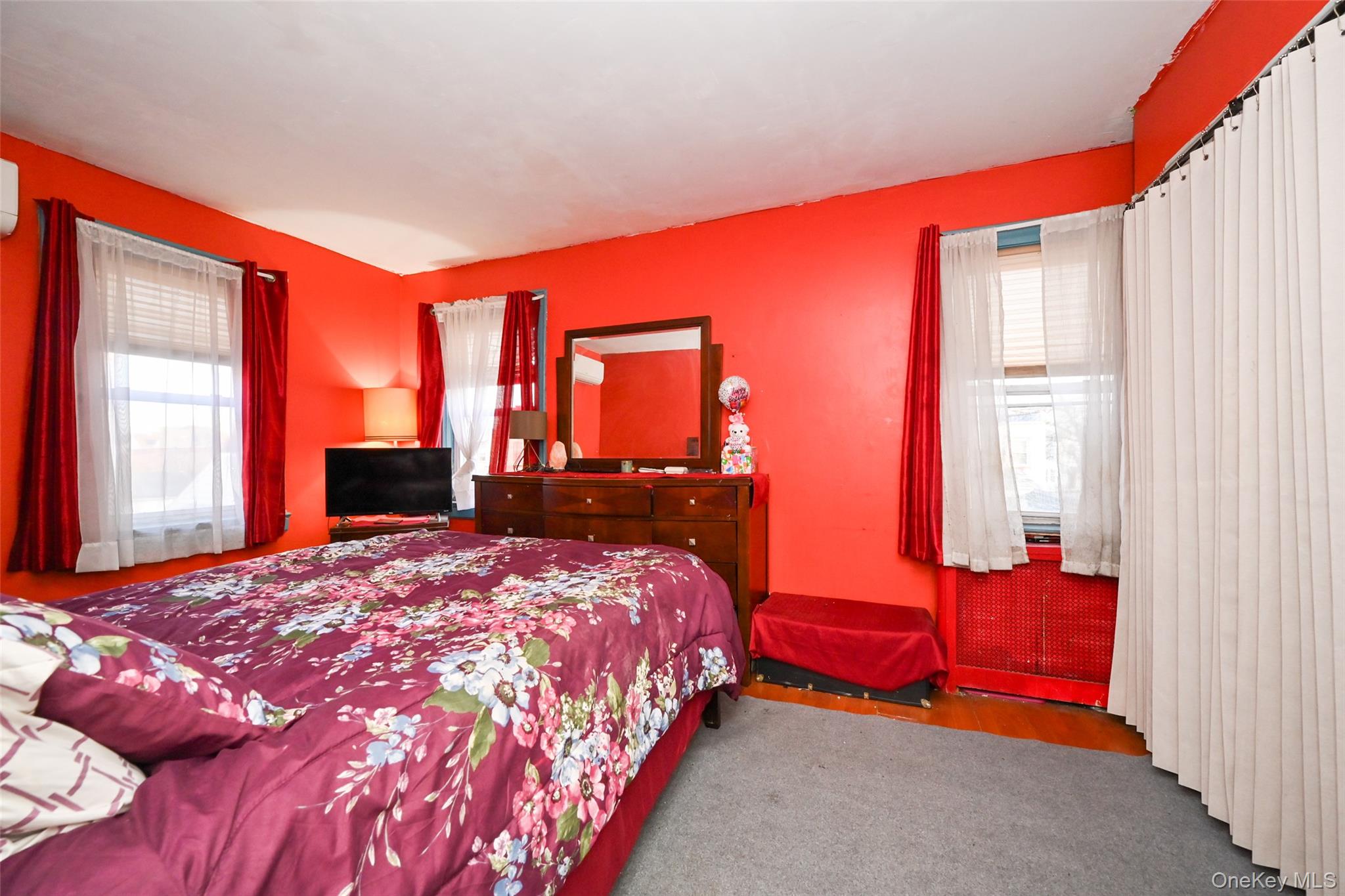 134-21 229th Street Queens, NY 11413 - Photo 14 of 25 a bedroom with a bed and window