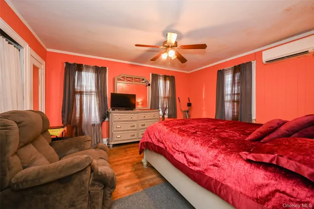 a bed room with a bed and a chandelier