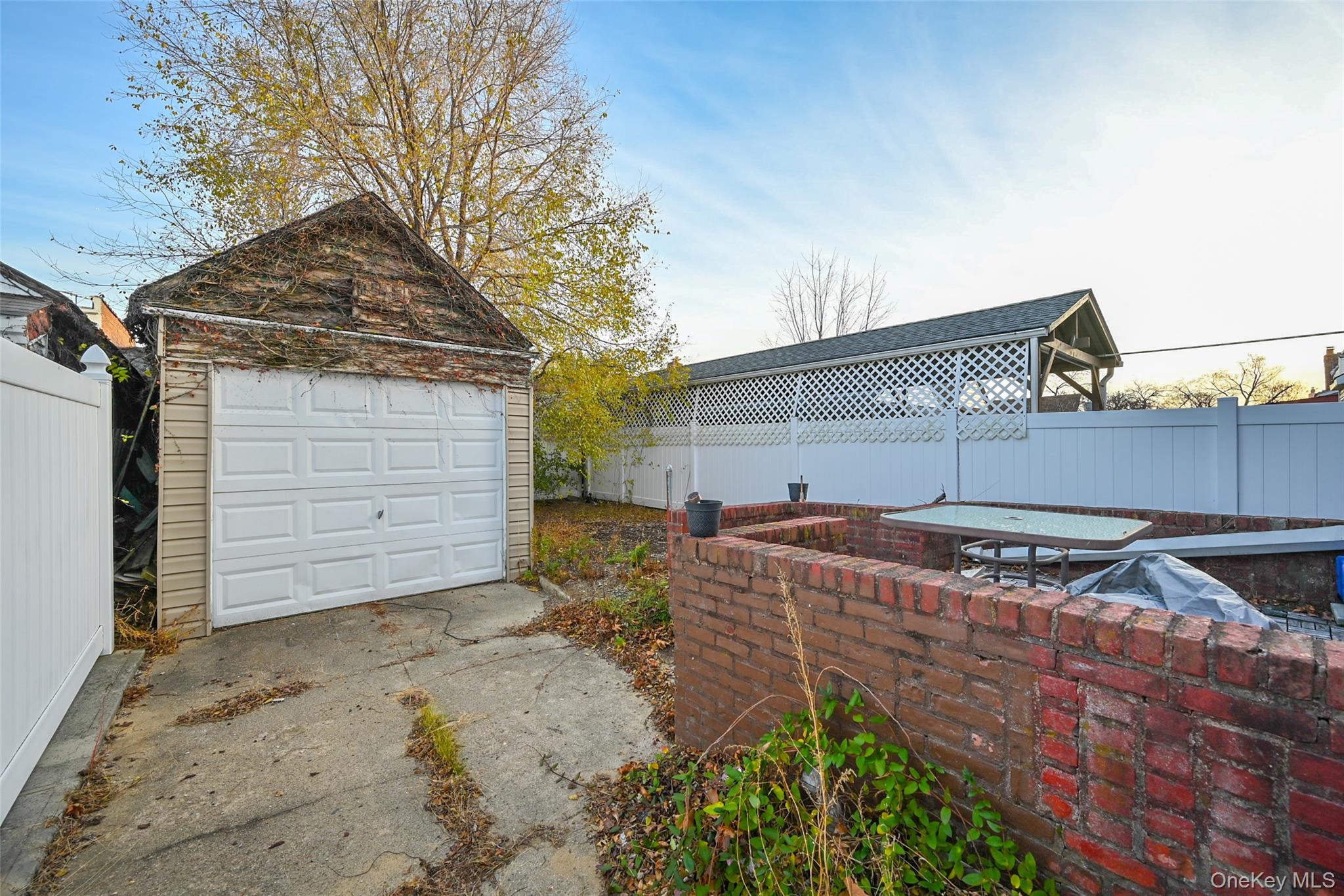 134-21 229th Street Queens, NY 11413 - Photo 21 of 25 a view of a house with a backyard