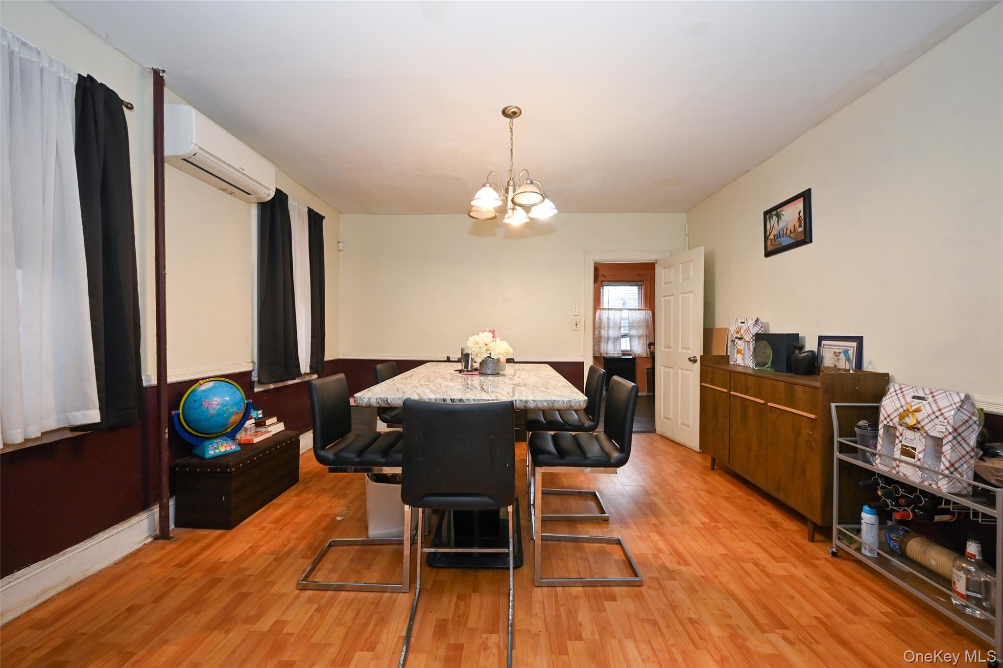 134-21 229th Street Queens, NY 11413 - Photo 9 of 25 a living room with furniture and wooden floor